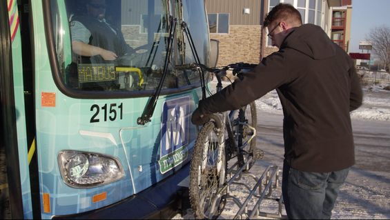 Rider Using Bike Rack